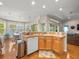 Kitchen area featuring modern dishwasher, cabinets, and view to the living room at 4292 Tahiti Dr, Hernando Beach, FL 34607