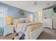 Serene bedroom featuring a king bed, soft lighting, and a calming blue color scheme at 4292 Tahiti Dr, Hernando Beach, FL 34607