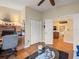 Bright office with hardwood floors, desk workstation, and doorway to living room at 4292 Tahiti Dr, Hernando Beach, FL 34607