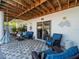 Covered patio features tile flooring, ceiling and comfortable seating at 4292 Tahiti Dr, Hernando Beach, FL 34607