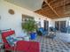 Spacious covered patio with tile flooring, seating, and decor at 4292 Tahiti Dr, Hernando Beach, FL 34607