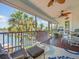 Relaxing screened porch with a ceiling fan and views of the water at 4292 Tahiti Dr, Hernando Beach, FL 34607