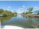 Scenic waterfront view with calm waters and lush greenery, a tranquil setting for waterfront living at 4292 Tahiti Dr, Hernando Beach, FL 34607