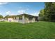 Backyard with lush lawn at 4424 Whitetail Ln, New Port Richey, FL 34653