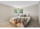 Bright bedroom featuring tile floors, neutral walls, and two windows offering natural light at 4424 Whitetail Ln, New Port Richey, FL 34653