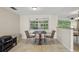 Cozy dining area with a large window, perfect for casual meals and entertaining at 4424 Whitetail Ln, New Port Richey, FL 34653