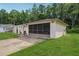 Spacious garage with screen doors, offering a flexible space for parking and outdoor enjoyment at 4424 Whitetail Ln, New Port Richey, FL 34653