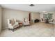Bright living room featuring tile floors, neutral walls, and comfortable seating arrangement at 4424 Whitetail Ln, New Port Richey, FL 34653