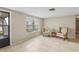 Inviting living room with tiled floors and comfortable seating, filled with natural light at 4424 Whitetail Ln, New Port Richey, FL 34653