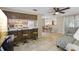 Open living space featuring bar seating to the kitchen and an adjacent dining area at 4424 Whitetail Ln, New Port Richey, FL 34653