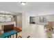 Open living space with tiled floors seamlessly connecting living, dining, and kitchen areas at 4424 Whitetail Ln, New Port Richey, FL 34653