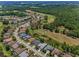Expansive aerial view of a residential area and lush green landscape with a golf course at 4485 Gevalia Dr, Brooksville, FL 34604