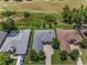 Aerial view of the home showcasing lush landscaping and proximity to the golf course at 4485 Gevalia Dr, Brooksville, FL 34604