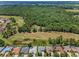 An aerial view highlighting neighborhood with lush greenery, and easy access to the golf course at 4485 Gevalia Dr, Brooksville, FL 34604