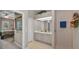Bathroom with double sink vanity, tiled floor, and a walk-in shower at 4485 Gevalia Dr, Brooksville, FL 34604