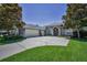 Charming home featuring arched entryways, a three car garage and manicured lawn at 4485 Gevalia Dr, Brooksville, FL 34604