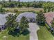 Stunning home with mature landscaping, golf course views, and a spacious driveway at 4485 Gevalia Dr, Brooksville, FL 34604