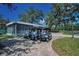 Golf carts parked outside the Pro Shop, surrounded by beautiful oak trees at 4485 Gevalia Dr, Brooksville, FL 34604