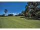 Scenic view of the golf course featuring lush green fairways, mature trees, and a serene atmosphere at 4485 Gevalia Dr, Brooksville, FL 34604