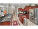 Modern kitchen boasts stainless steel appliances, a granite island, and access to the dining area at 4485 Gevalia Dr, Brooksville, FL 34604