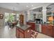 Open kitchen with stainless steel appliances, granite countertops, and a center island at 4485 Gevalia Dr, Brooksville, FL 34604