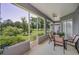Relaxing screened lanai with a view of the lush green golf course at 4485 Gevalia Dr, Brooksville, FL 34604