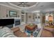 Open-concept living room with fireplace, neutral color scheme, and seamless transition to other living areas at 4485 Gevalia Dr, Brooksville, FL 34604
