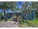 Charming Pro Shop with stairs, brick pathway, and mature trees at 4485 Gevalia Dr, Brooksville, FL 34604