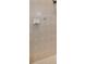 Tiled shower with a shower head and built-in soap dish at 4485 Gevalia Dr, Brooksville, FL 34604