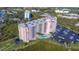 Aerial view of a beautiful condo building with a pool and parking at 4516 Seagull Dr # 512, New Port Richey, FL 34652