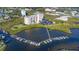 Stunning aerial view of waterfront condo community with boat docks and lush landscaping in a desirable location at 4516 Seagull Dr # 512, New Port Richey, FL 34652