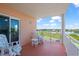 Relaxing condo balcony with two Adirondack chairs and lovely water views at 4516 Seagull Dr # 512, New Port Richey, FL 34652