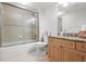 Bathroom features granite countertops, wood cabinets, and a tiled shower/tub combo at 4516 Seagull Dr # 512, New Port Richey, FL 34652