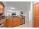 Inviting kitchen with granite counters and stainless appliances, offering views of the bright and open living space at 4516 Seagull Dr # 512, New Port Richey, FL 34652