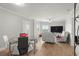 Bright and airy living room with contemporary furnishings, dining area, and access to balcony with water views at 4516 Seagull Dr # 512, New Port Richey, FL 34652