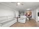 Open concept living area flows into dining area with wood-look floors and modern decor at 4516 Seagull Dr # 512, New Port Richey, FL 34652