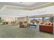 Bright, spacious lounge area with stylish seating and large windows at 4516 Seagull Dr # 512, New Port Richey, FL 34652