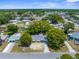 Neighborhood aerial view showing the home's location amongst mature trees and adjacent houses at 4520 Blanche St, New Port Richey, FL 34652