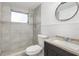 A minimalist bathroom featuring a stand up shower, toilet, and vanity at 4520 Blanche St, New Port Richey, FL 34652
