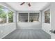Bright bedroom featuring neutral walls, ceiling fan, carpet and three windows offering natural light at 4520 Blanche St, New Port Richey, FL 34652