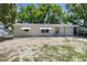 Exterior elevation of home showing the entrance, awning, and garage at 4520 Blanche St, New Port Richey, FL 34652