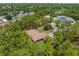 Aerial view of home surrounded by trees in a quiet neighborhood at 4960 Hidden Knob Trl, Spring Hill, FL 34609