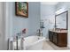 Bright bathroom featuring a freestanding tub, vanity with countertop, and stylish fixtures at 4960 Hidden Knob Trl, Spring Hill, FL 34609