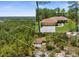 Aerial view of property boundaries and home nestled among tall trees in a peaceful, wooded neighborhood at 4960 Hidden Knob Trl, Spring Hill, FL 34609