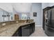 Granite countertops with a kitchen bar overlooking the dining area and modern appliances at 4960 Hidden Knob Trl, Spring Hill, FL 34609