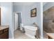 Elegant main bathroom with a freestanding tub, vanity, and separate tiled shower with unique fixtures at 4960 Hidden Knob Trl, Spring Hill, FL 34609