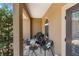 Covered front porch with cozy seating area, offering a relaxing outdoor space at 4960 Hidden Knob Trl, Spring Hill, FL 34609