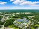 Breathtaking aerial view of ponds and community features amongst the homes of the verdant neighborhood at 5005 Southern Valley Loop, Brooksville, FL 34601