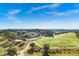 Stunning aerial view of the golf course, featuring a grand clubhouse and meticulously maintained fairways at 5005 Southern Valley Loop, Brooksville, FL 34601