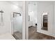 Sleek bathroom with tiled shower, glass partition, and view into the spacious vanity area at 5005 Southern Valley Loop, Brooksville, FL 34601